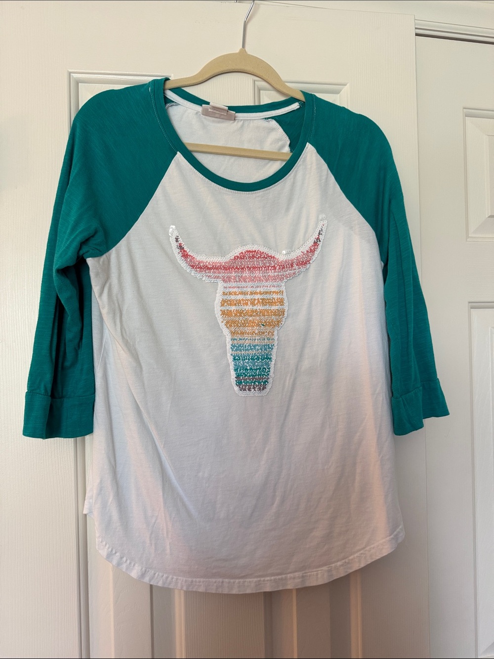 Women’s Teal Sleeve White Raglan Top with Sequin Bull Skull - changing message
